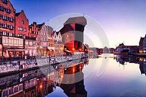 Illuminated Gdansk Old Town with Calm Motlawa River at Sunrise, Poland