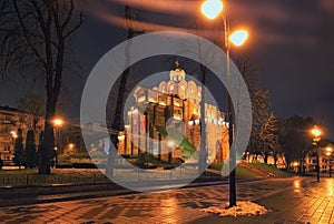 Illuminated Golden Gate and Yaroslav the Wise monument - one of the famous landmark of Kyiv at winter morning. Ukraine.