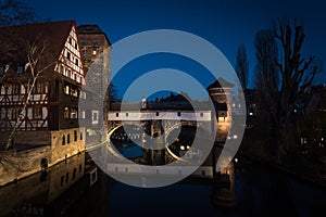 Illuminated Henkersteg bridge after dark in Nurnberg, Bavaria, Germany. Cityscape image view from MaxbrÃ¼cke