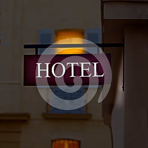 Illuminated hotel purple sign