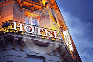 Illuminated hotel sign in Paris at night