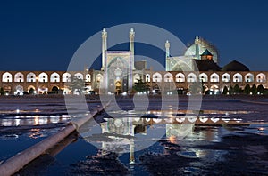 Illuminated Imam Mosque and Its Reflection on Water Puddle, in Naqshe Jahan Square of Isfahan