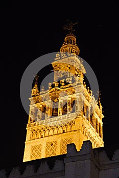 Illuminated La Giralda tower at night. Seville, Spain. photo