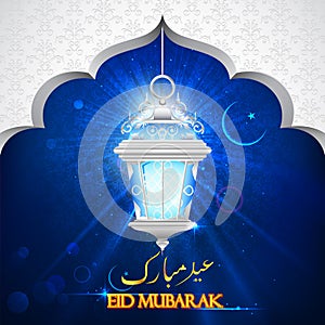 Illuminated lamp on Eid Mubarak background