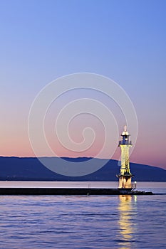 Illuminated light house at Lake Geneva, Switzerland