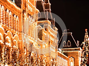 Illuminated lights on facade of GUM Festive background. Christmas illuminations and decorations of Christmas and New