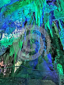 Illuminated limestone caves and stalagmite formations in St. Michael\'s Caves, Gibraltar