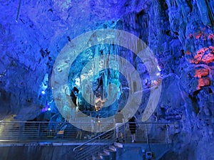 Illuminated limestone caves and stalagmite formations in St. Michael\'s Caves, Gibraltar