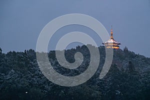 Illuminated Ling Jiou Buddhist temple on a mountain in Taipei, Taiwan in the evening