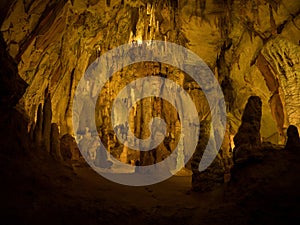 Illuminated lit lights stalagmites stalactites limestone show cave cavern Grutas da Moeda in Batalha Leiria Portugal