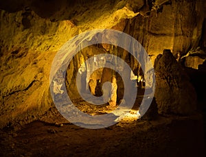 Illuminated lit lights stalagmites stalactites limestone show cave cavern Grutas da Moeda in Batalha Leiria Portugal photo