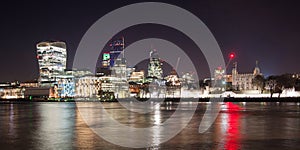 Illuminated London skyline by night