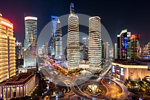 Illuminated Lujiazui skyline and Ring road circular footbridge, Shanghai, China