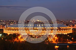 Illuminated Luzhniki Stadium at evening