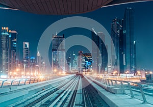 Illuminated modern architecture of Dubai downtown by night