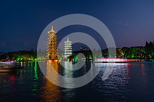 Illuminated at night Sun and moon pagodas in Guilin