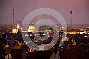 Illuminated Nurnberg skyline with powerplant chimney and TV Tower, Bavaria, Germany. Cityscape image from castle