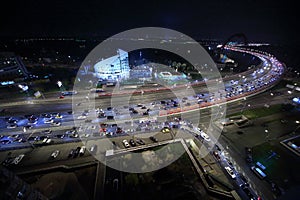 Illuminated office building and Zhivopisny Bridge