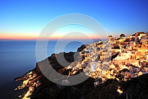 Illuminated Oia Village at Sunset on Santorini Island