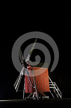 Illuminated old traditional windmill in Sweden
