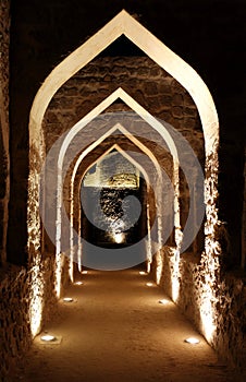 Illuminated passage inside Bahrain fort