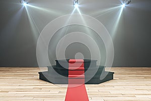 Illuminated podium with red carpet