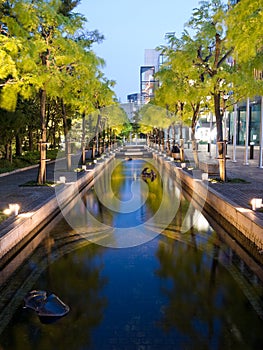 Illuminated pools of water at night