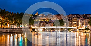 Illuminated quays and footbridge, in Lyon, in the RhÃÂ´ne, France photo