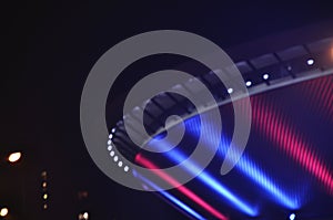 Illuminated in red and blue, the Spodek in Katowice