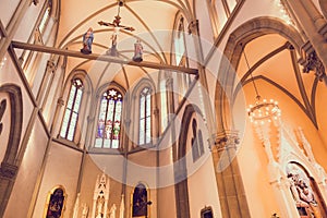 Illuminated Roman Catholic Church with Stained Glass Windows