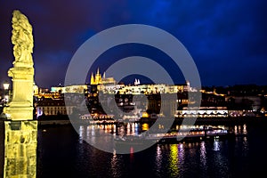 Illuminated Saint Vitus Cathedral, Hradcany Castle And River Moldova In The Night In Prague In The Czech Republic