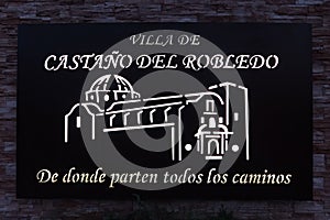 Illuminated sign at the entrance of the town with the text CastaÃÂ±o del Robledo where all the roads start from photo
