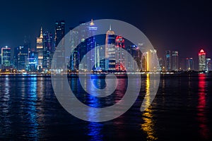Illuminated skyline in West Bay, Doha Qatar photo