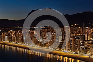 Illuminated skyscrapers of a Benidorm city at night. Spain