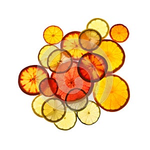 Illuminated slices of citrus fruits on white background