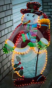 Illuminated snowman in the street