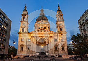 Lluminated St. Stephen`s Basilica on St. Stephen`s square evening shot in Pest part of Budapest, Hungary photo