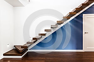 Illuminated stairs in modern house photo