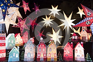Illuminated stars and houses on Christmas fair, Germany
