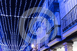 Illuminated street with blue Christmas illumination.