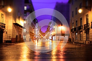 Illuminated street of old european town at night.