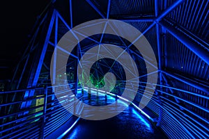 Illuminated Murinsel artificial island bridge construction, Graz, night scene, , Austria photo
