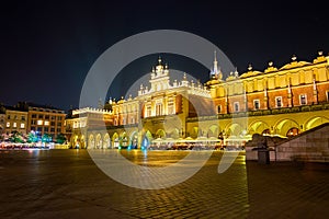 The illuminated Sukiennice in Krakow, Poland