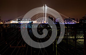 Illuminated Suspended bridge over railway urban modern landmark city night scene