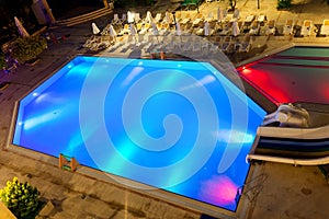 Illuminated swimming pool at night