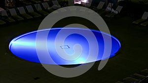 Illuminated swimming pool at night