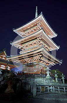 The illuminated three-storied pagoda at night. Kiyomizu-dera (Otowa-san) temple. Kyoto. Japan