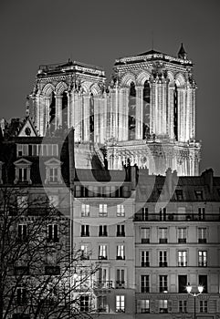 Illuminated towers of Notre Dame de Paris Cathedral at night