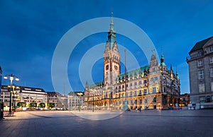 Illuminated Town Hall at dusk in Hamburg, Germany