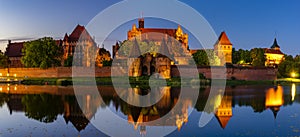 Illuminated walls of the Malbork Castle at night